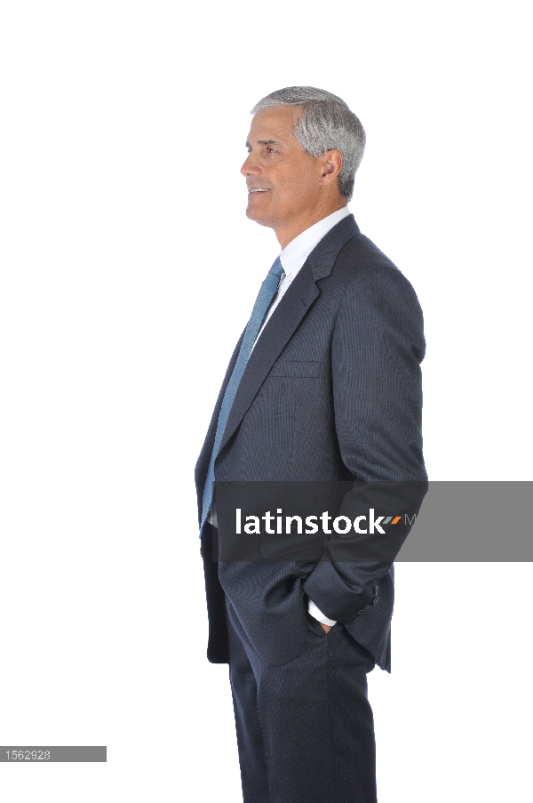 Businessman with hands in pockets profile view